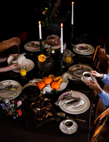 Dinner table spread with candles